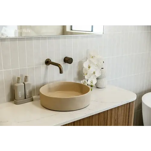 Modern bathroom vanity with Beaumont Tiles wall tiles and basin