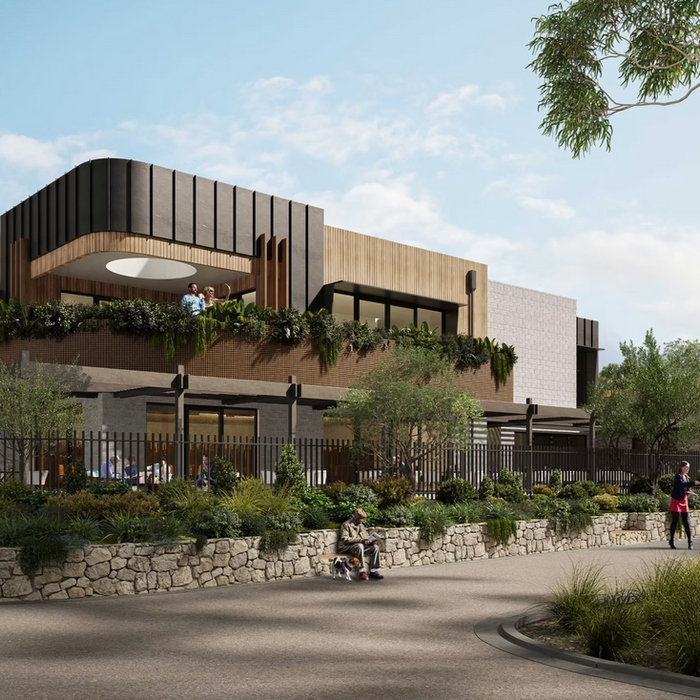 Modern architectural building surrounded by lush trees and landscaped gardens