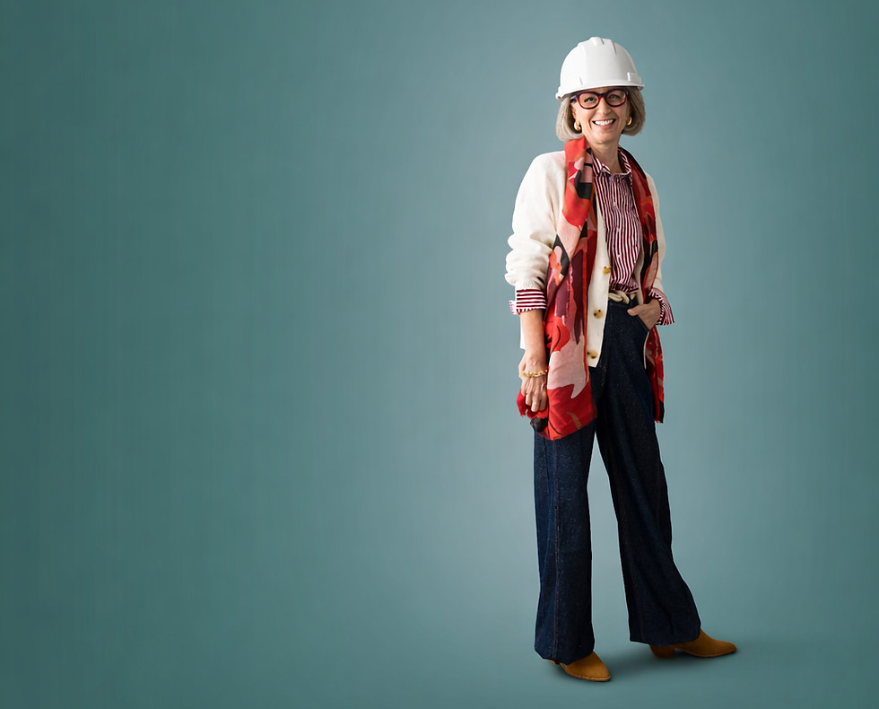 Smiling older woman wearing a hard hat against