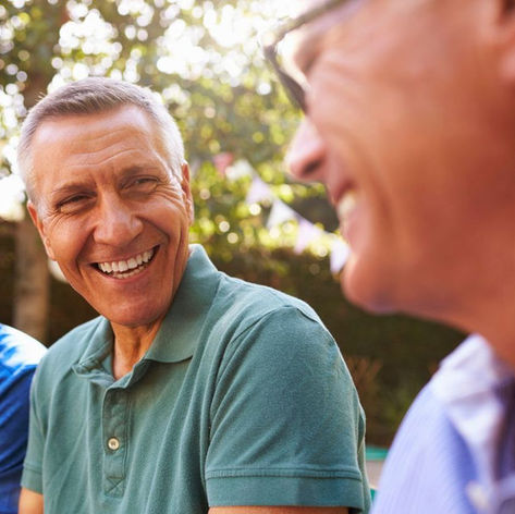 Smiling senior man enjoying an outdoor conversation