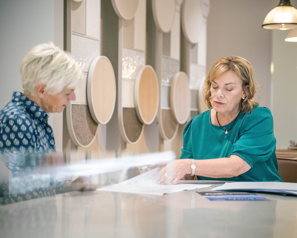Sales Manager Leonie Sexton with a visitor at the ReGen Living Sales Gallery